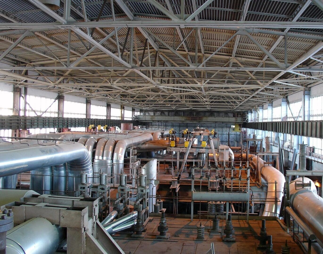 A large hangar with many pipes and tubes.